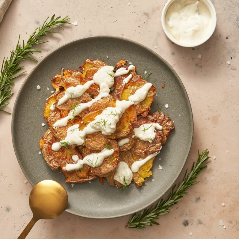 Herb Smashed Potatoes with Feta Garlic Dressing